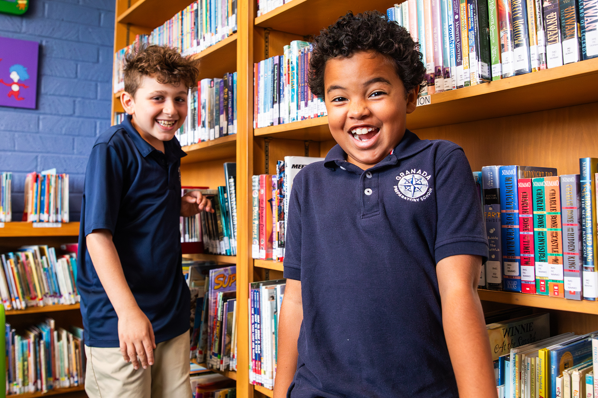 Two students reading at the library